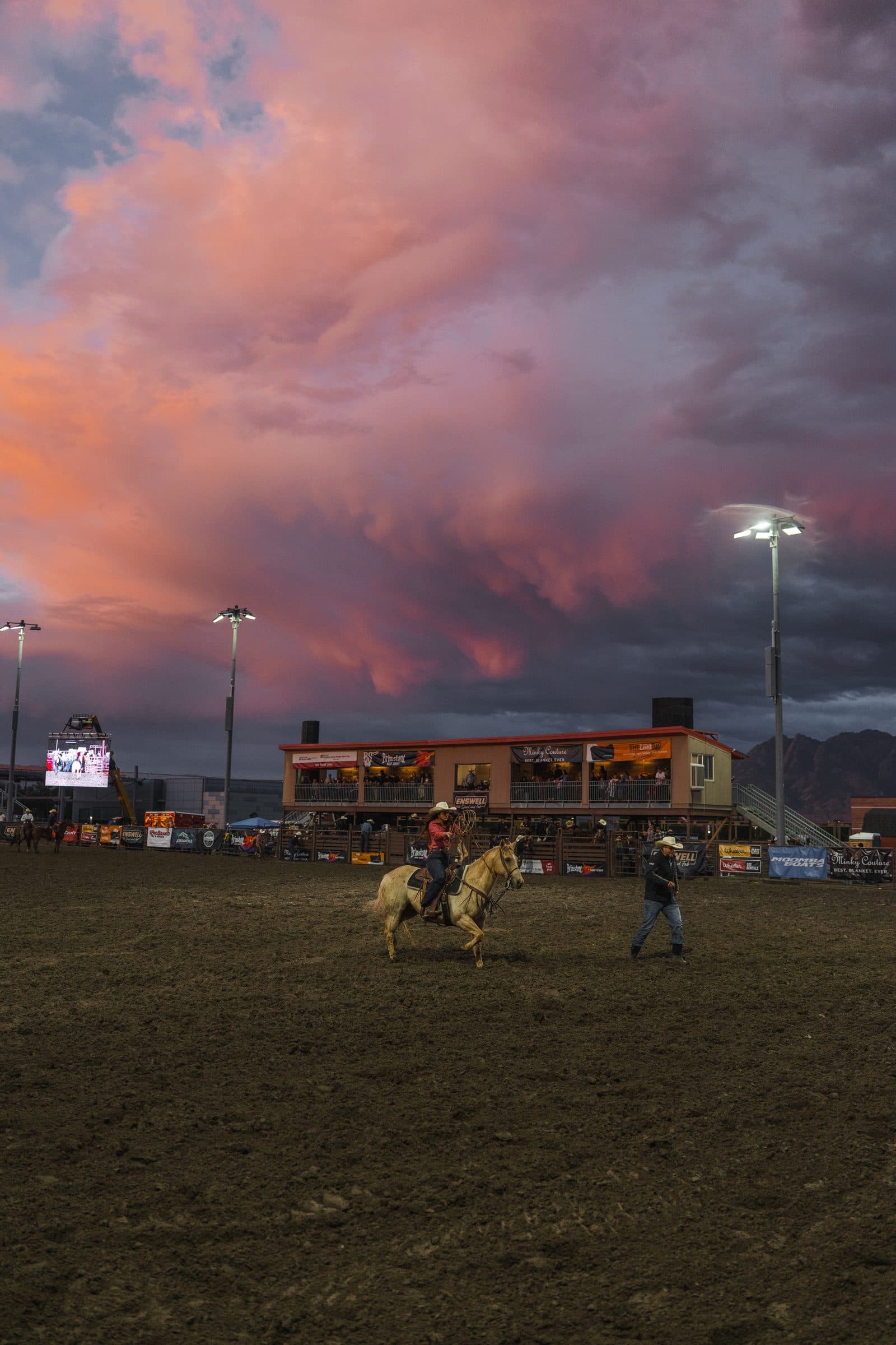 The arena under pink cloud, lights already on